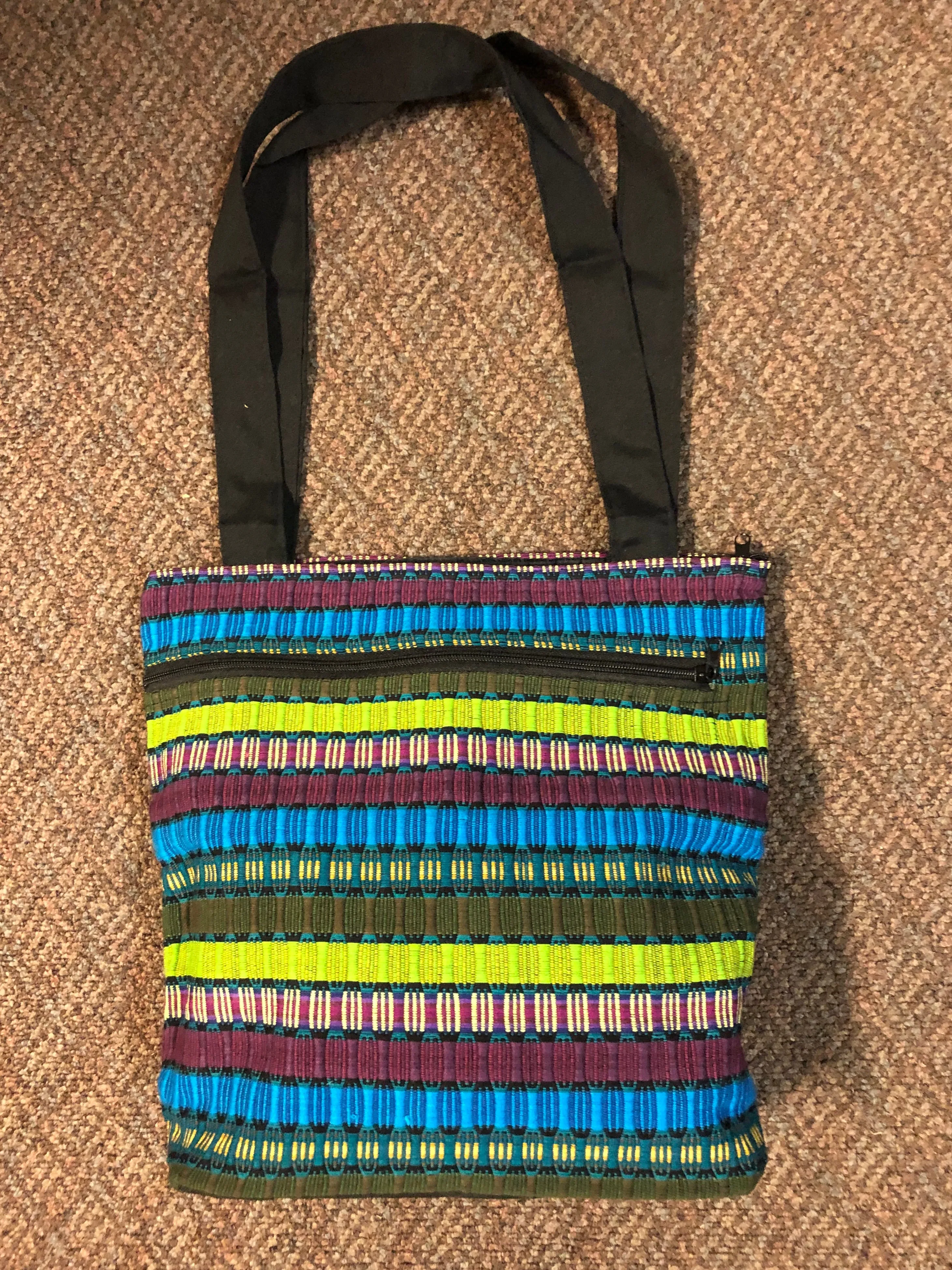 Guatemalan honeycomb weave hand bag with exterior zipper compartment. Approximately 13” x 13”